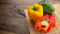 Sweet pepper on wood background, paprika, red, green and yellow sweet bell peppers Royalty Free Stock Photo