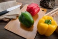 Sweet pepper on wood background, paprika, red, green and yellow sweet bell peppers on table Royalty Free Stock Photo