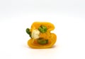 Sweet pepper yellow in cross-section on a light background.
