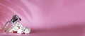Sweet perfume bottle used almost empty on pink background. long shadows. copy space. banner