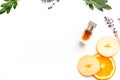 Sweet perfume with fruit fragrance. Bottle of perfume near apple, orange, lavender on white background top view spac