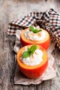 Sweet persimmons stuffed with cottage cheese and almonds on woo