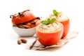 Sweet persimmons stuffed with cottage cheeseand almonds isolat