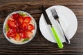 Sweet pie with strawberry and kiwi in mold from foil, knife and fork in plate on wooden table. Top view Royalty Free Stock Photo