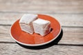 Sweet pieces of turkish delight on brown saucer Royalty Free Stock Photo