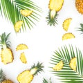 Sweet pineapple and mango fruits with palm leaf on white background. Flat lay Royalty Free Stock Photo