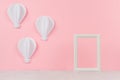 Sweet pink art background - white paper origami aerostats and blank frame for design. Royalty Free Stock Photo