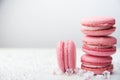 Sweet pink macaroons on wooden table Royalty Free Stock Photo