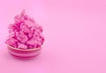 Sweet pink popcorn on paper background. Fashion pop art style. Top view.