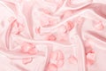 sweet pink roses petal on soft pink silk fabric , romance and Royalty Free Stock Photo