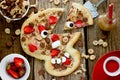 Sweet pizza in the form of funny skull to treat kids for Halloween