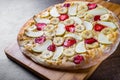 Sweet Pizza with Mozzarella cheese, apple, banana, strawberries. Fruit dessert pizza on wooden table Royalty Free Stock Photo
