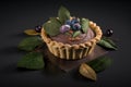 sweet plum mini pie decorated with leaves and berries