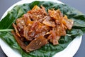 Sweet pork or pork Jerky on noni or morinda citrifolia leaf.