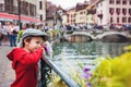 Sweet portrait of preschool boy in the town of Annecy, France, s