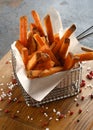 Sweet potato chips Fries on a wooden Board Royalty Free Stock Photo