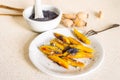 Sweet potato dumplings wedges with poppy seed, poppy heads, mortar Royalty Free Stock Photo