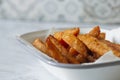 Sweet potato French fries chips in a white enamel dish bowl. Royalty Free Stock Photo