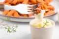 Sweet potato fries in a bowl with mayo sauce, homemade roasted pumpkin in the oven, close up Royalty Free Stock Photo