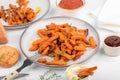 Sweet potato fries in a bowl with mayo sauce, homemade roasted pumpkin in the oven, close up Royalty Free Stock Photo