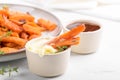 Sweet potato fries in a bowl with mayo sauce, homemade roasted pumpkin in the oven, close up Royalty Free Stock Photo