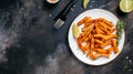 Sweet potato fries with herbs on dark background. Long banner format. top view Royalty Free Stock Photo