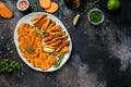 Sweet potato fries with herbs on dark background. Long banner format. top view Royalty Free Stock Photo