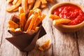 sweet potato fries with rosemary, and ketchup close-up. horizontal, rustic Royalty Free Stock Photo