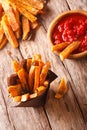 Sweet potato fries with rosemary, and ketchup close-up. Vertical Royalty Free Stock Photo