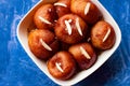 Sweet Potato Gulab Jamun an Indian dessert on a bowl , decorated with almond on blue surface Royalty Free Stock Photo