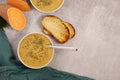 sweet potato puree soup with garlic bread on grey marble table Royalty Free Stock Photo