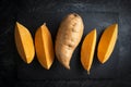Sweet potato raw pieces old background Royalty Free Stock Photo