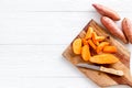 Sweet potato - sliced yams organic vegetables on cutting board, view from above