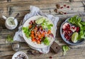 Sweet potato wrap. Delicious vegetarian snack. On a wooden rustic table Royalty Free Stock Photo