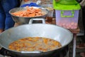 Sweet Potatoes being fried in Frying Pan with Heat Palm Oil Royalty Free Stock Photo