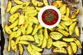 Sweet potatoes with greens and ketchup close - up on the table Royalty Free Stock Photo