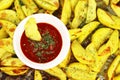 Sweet potatoes with greens and ketchup close - up on the table Royalty Free Stock Photo