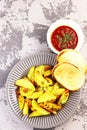 Sweet potatoes with greens and ketchup close - up on the table Royalty Free Stock Photo