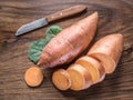 Sweet potatoes on the old wooden table. Royalty Free Stock Photo