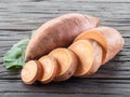 Sweet potatoes on the old wooden table Royalty Free Stock Photo