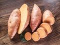 Sweet potatoes on the old wooden table. Royalty Free Stock Photo