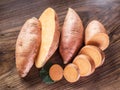 Sweet potatoes on the old wooden table.