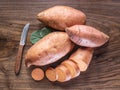 Sweet potatoes on the old wooden table Royalty Free Stock Photo