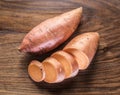 Sweet potatoes on the old wooden table Royalty Free Stock Photo