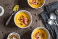 Sweet potatoes, spicy chickpea and shrimp soup. On a wooden table, top view.