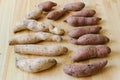 Sweet potatoes wooden background