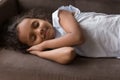 Sweet pretty Indian girl kid resting on comfortable sofa Royalty Free Stock Photo