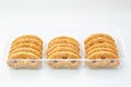 Sweet pretzels ,cookies in plastic transparent box on white background, isolated, front view