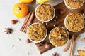 Sweet pumpkin vegan muffins with fall spices on wooden board. Autumn dessert. Healthy baking concept. Top view Royalty Free Stock Photo