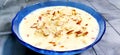 Sweet Rabdi or Lachha Rabri or basundi, made with pure milk garnished with dry fruits. Served in a bowl over moody background Royalty Free Stock Photo